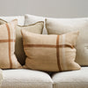 clintock feather cushion from corcovado furniture on a boucle sofa