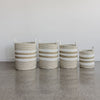 A collection of 4 natural and white seagrass basket with handles from corcovado furniture and decor store new zealand