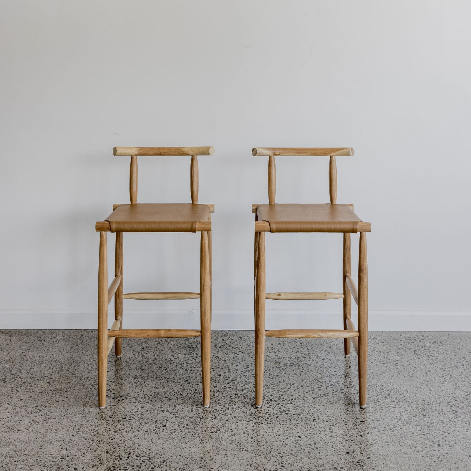 Set of Two Zanzi Bar Stools (tan leather, natural teak)