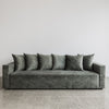 front view of the sunset 4 seater sofa made in new zealand shown in jade green velvet