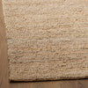corner view of the papeete floor rug in jute from corcovado furniture