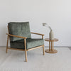 green velvet occasiobal chair with cotton reel side table from corcovado furniture store