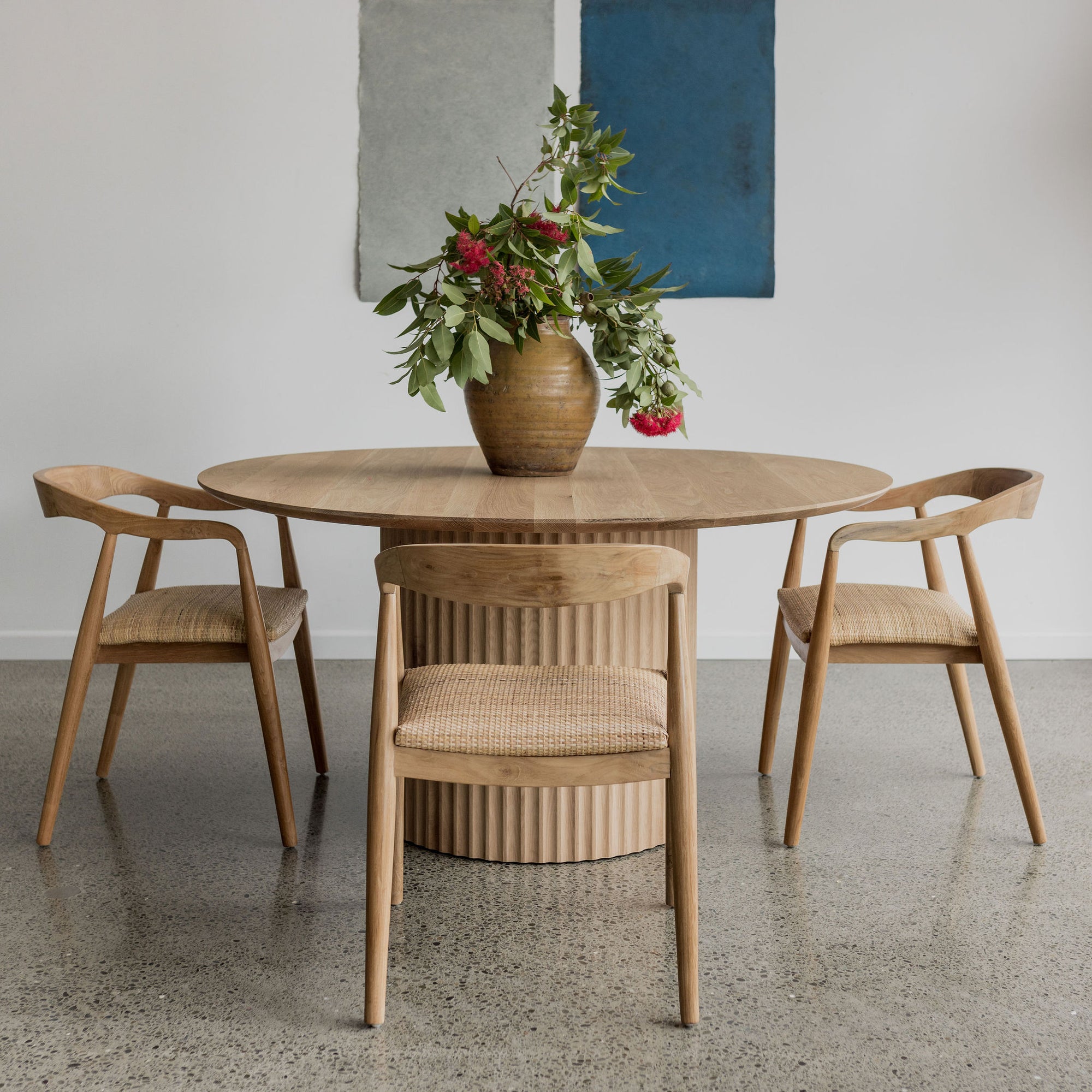 Delos Round Table is a stylish table design from corcovado furniture store online in new zealand and made in NZ and comes in small medium and large round pedestal table sizes in oak wood.